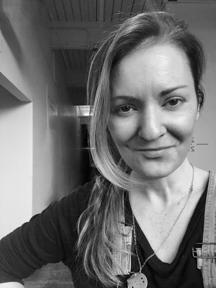 Black-and-white portrait of a smiling clubhouse member