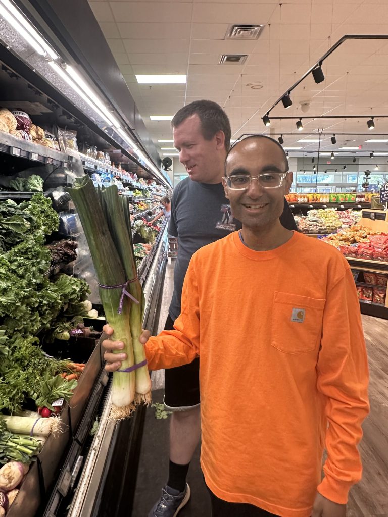 Clubhouse members shopping for fresh produce
