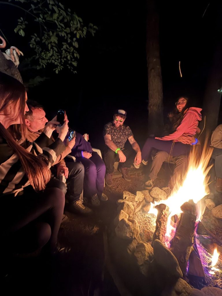 Members gathered outdoors at night