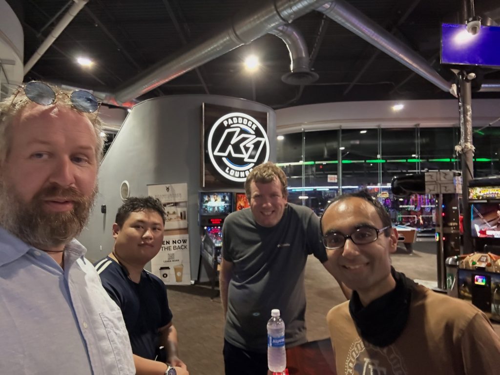 Members taking a group selfie at the go-kart track during the Mount Kisco trip